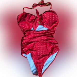 Coral one piece polka dots with removable straps. Worn once.